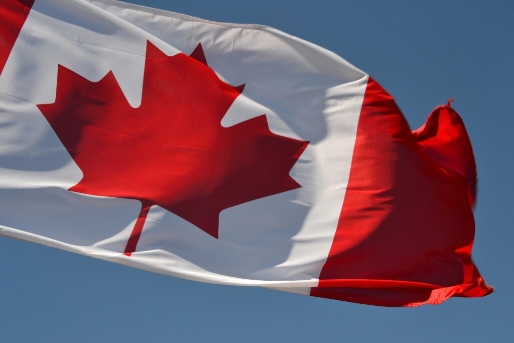 Canadian flag on a blue sky